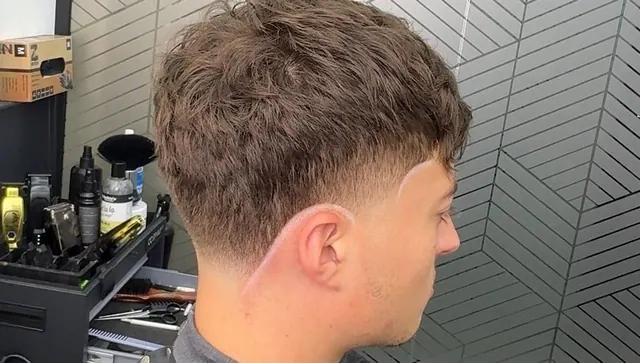 A textured crop with a taper and a shaped hairline
