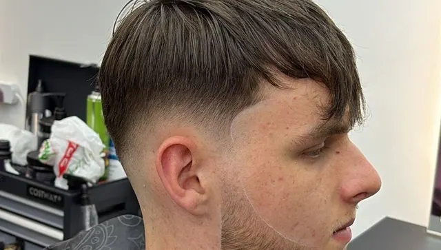 A fringe cut with a taper fade